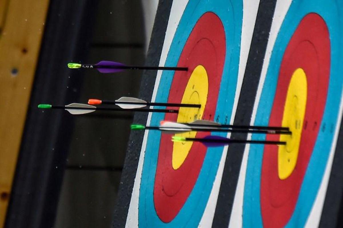 Picture of targets and arrows taken during the Women's Archery Compound Team final during the 2018 Central American and Caribbean Games (CAC), in Barranquilla, Colombia, on July 31, 2018.   Luis ROBAYO / AFP
