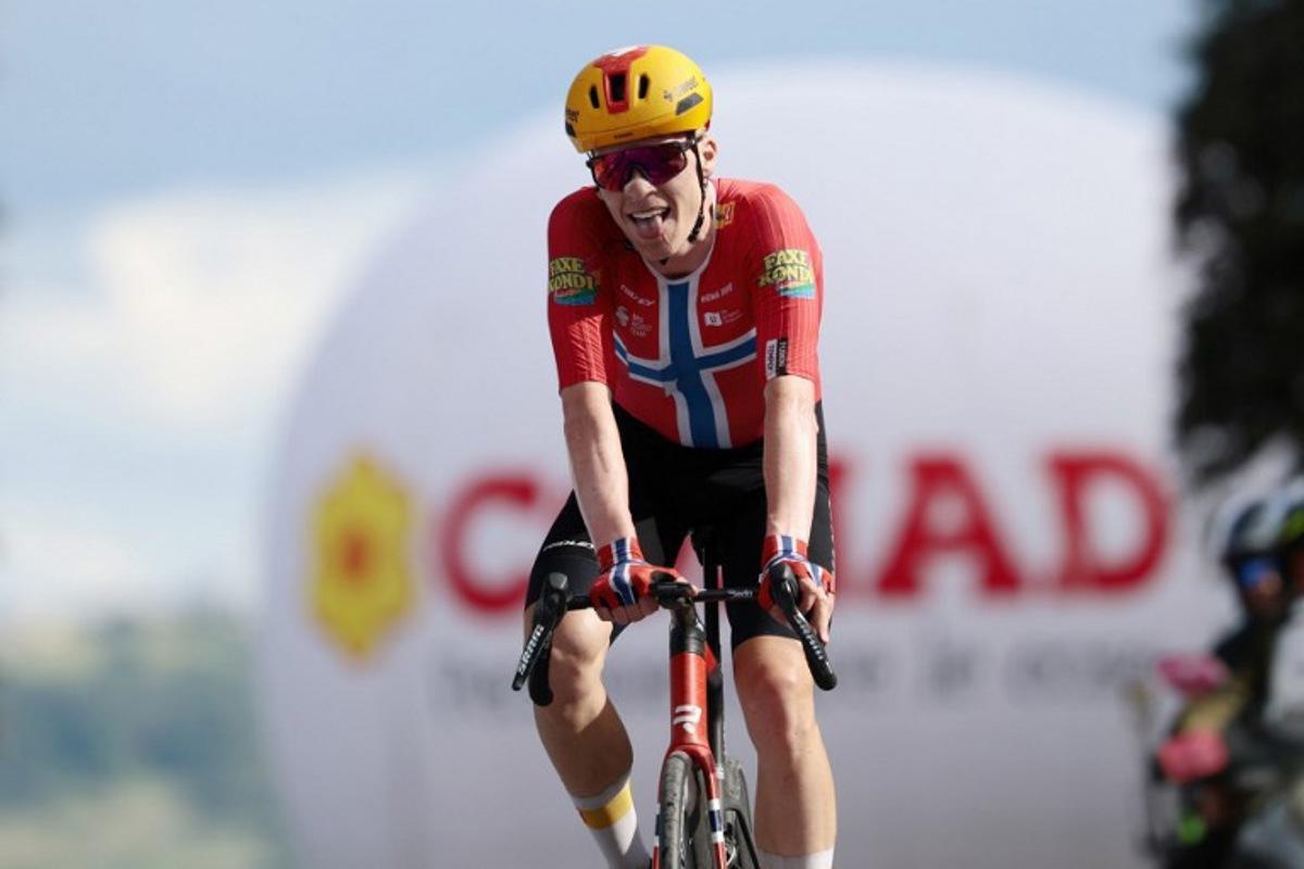 Second-placed Uno X Mobility Norwegian rider Andreas Leknessund celebrates as he crosses the finish line at the end of the 8th stage of the Giro d'Italia 2026 - Tour of Italy cycling race between Chieti and Fermo, central Italy on May 16, 2026.  Luca Bettini / AFP