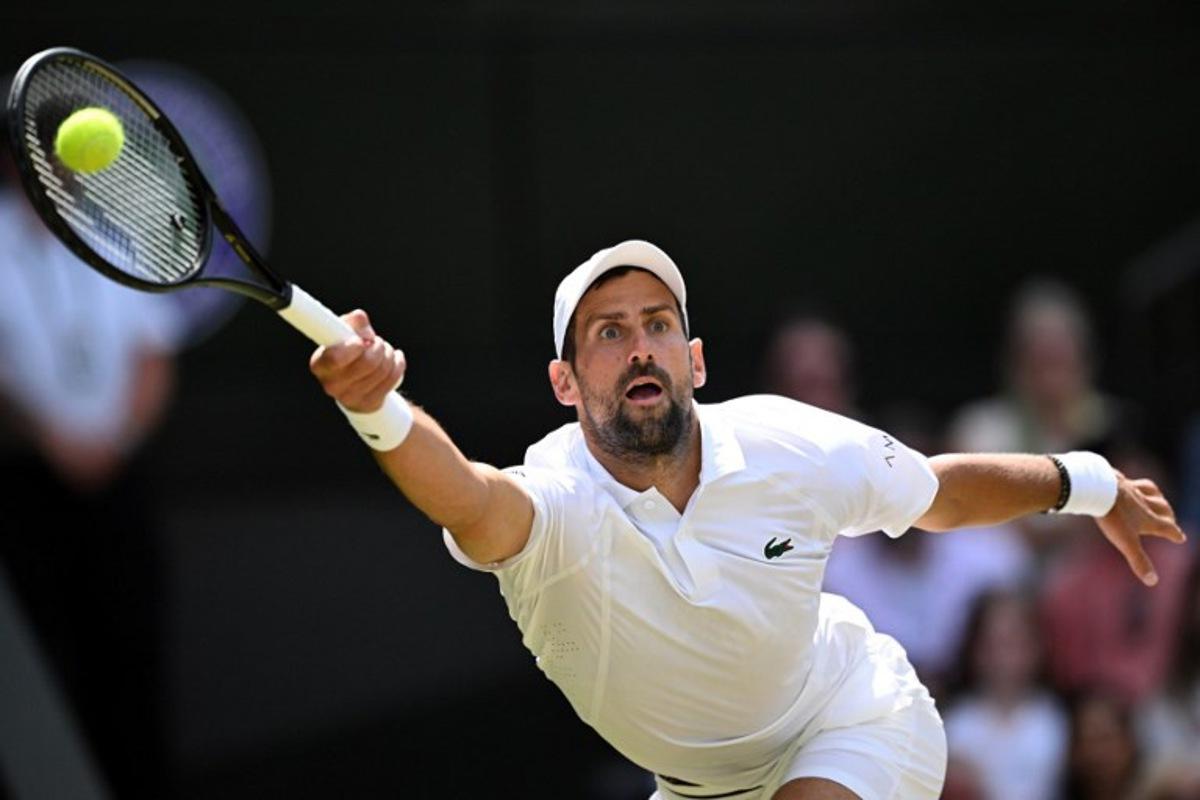 Serbia's Novak Djokovic returns to Russia's Roman Safiullin during their men's singles round of 16 tennis match on the seventh day of the 2026 Wimbledon Championships at The All England Lawn Tennis and Croquet Club in Wimbledon, southwest London, on July 5, 2026.  Kirill KUDRYAVTSEV / AFP