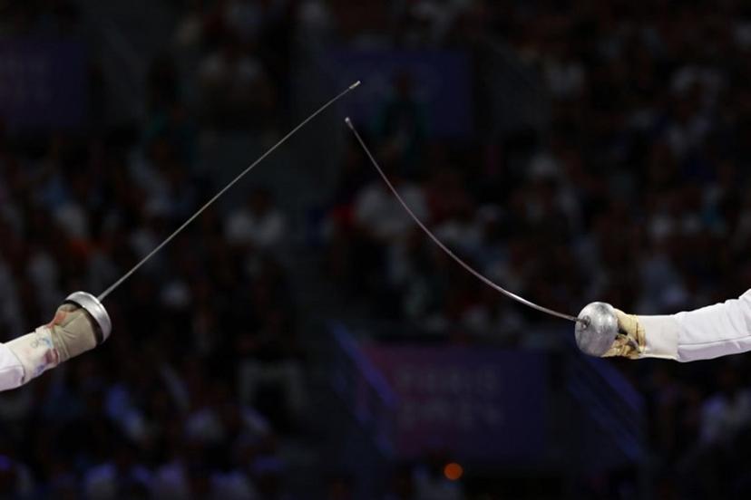 Czech Republic's Jiri Beran (L) competes against France's Yannick Borel in the men's epee team bronze medal bout between Czech Republic and France during the Paris 2024 Olympic Games at the Grand Palais in Paris, on August 2, 2024.  Franck FIFE / AFP