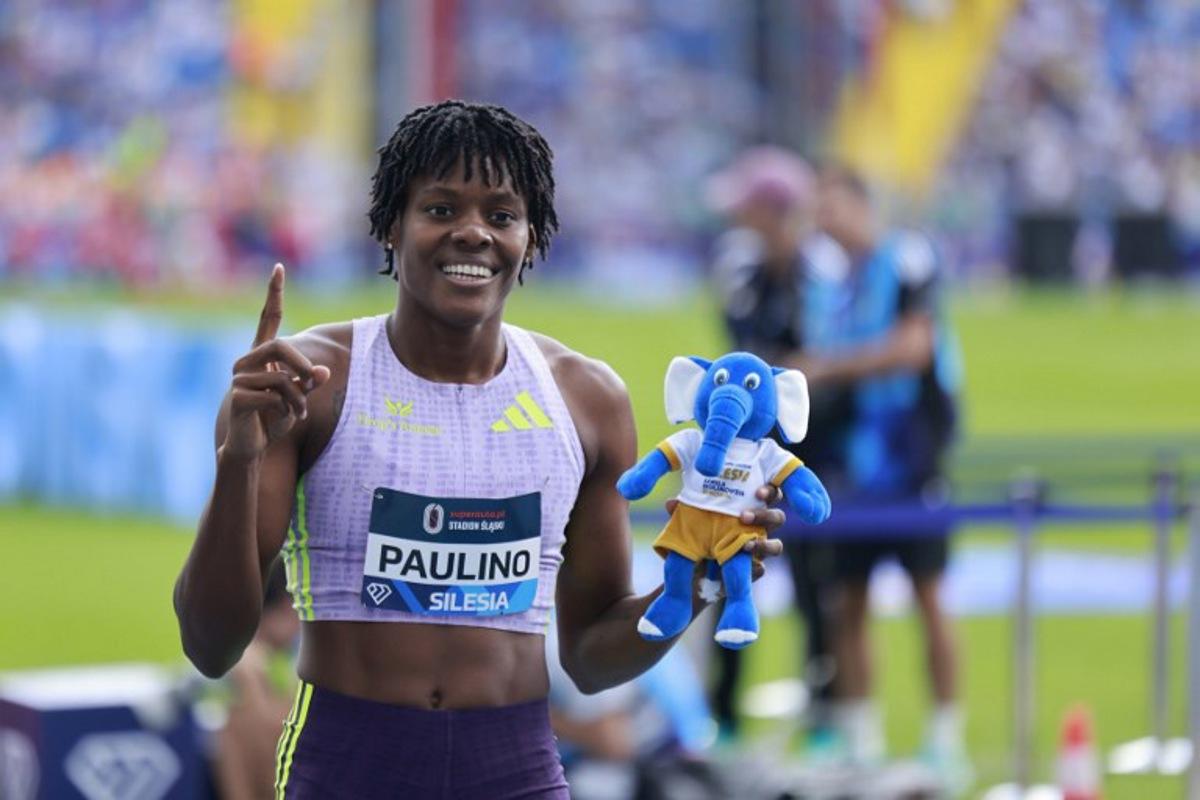 Winner Dominican Republic's Marileidy Paulino celebrates after the women's 400m event of the Silesia Diamond League athletics meeting in Katowice, Poland, on August 23, 2026.  Wojtek RADWANSKI / AFP