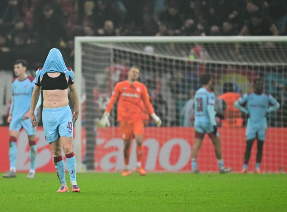 Feyenoord's Dutch defender #43 Jan Plug (L) reacts to the 4-3 during the UEFA Europa League first round - day 6 football match between FCSB Bucharest and Feyenoord in Bucharest, Romania, on December 11, 2025.  Daniel MIHAILESCU / AFP