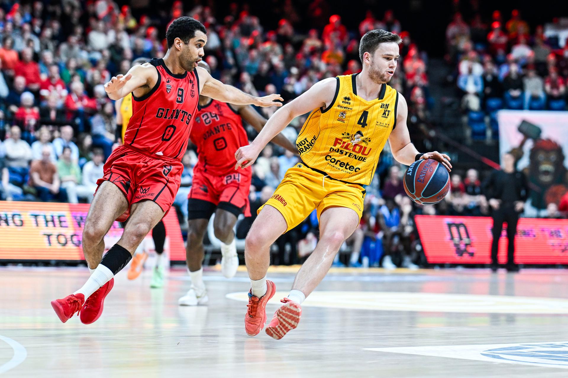 Antwerp's Elias Lasisi and Oostende's Simon Buysse pictured in action during a basketball match between Antwerp Giants and BC Oostende, Tuesday 10 March 2026 in Merksem, Antwerp, on day 22 of the 'BNXT League' Belgian/ Dutch first division basket championship. BELGA PHOTO TOM GOYVAERTS