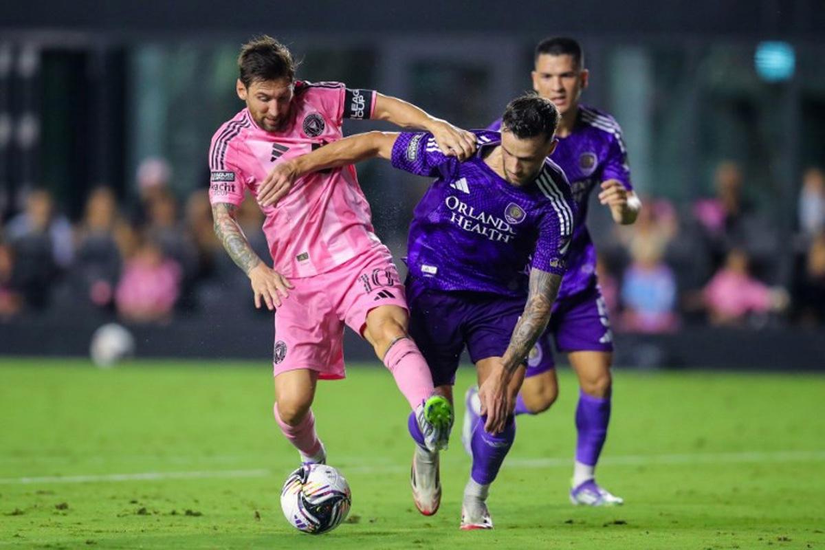 Inter Miami's Argentine forward #10 Lionel Messi fights for the ball with Orlando City's Slovenian defender #04 David Brekalo during the Leagues Cup semi-final football match between Inter Miami CF and Orlando City SC at Chase Stadium in Fort Lauderdale, Florida, on August 27, 2025.  Chris Arjoon / AFP