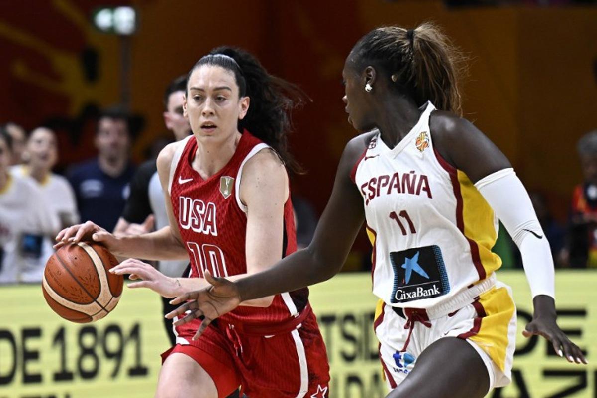 USA's power forward #10 Breanna Stewart and Spain's center #11 Awa Fam vie for the ball during the 2026 FIBA Women's Basketball World Cup semi-final match between Spain and the United States in Berlin on September 12, 2026.  Tobias SCHWARZ / AFP