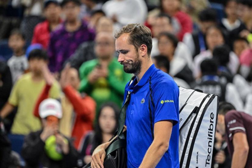 Russia's Daniil Medvedev walks off the court after being disqualified for hitting a ball into the stands, injuring a spectator, during the men's singles semi-final against Serbia's Novak Djokovic at the China Open tennis tournament in Beijing on October 5, 2026.  GREG BAKER / AFP