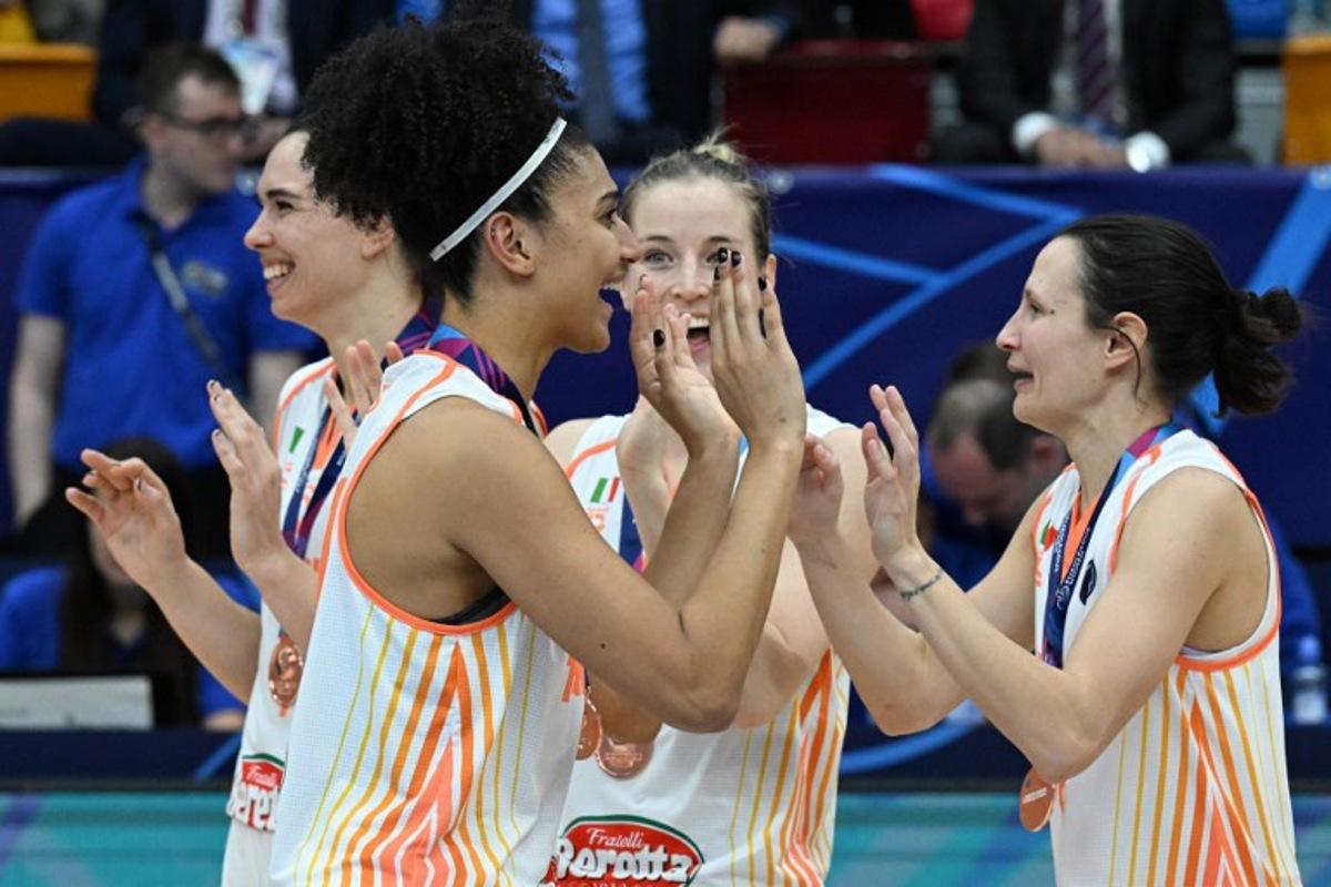 Players of Schio celebrate after defeating USK Prague in their third place match of the Euroleague Women's Final Four 2023 basketball match between USK Prague and Schio in Prague on April 16, 2023.  Michal Cizek / AFP