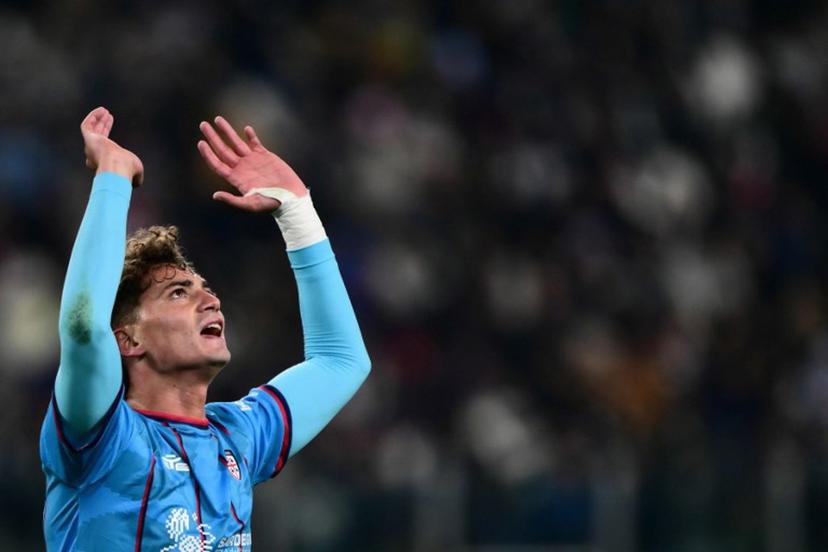 Cagliari's Italian forward #94 Sebastiano Esposito celebrates after scoring his team first goal during the Italian Serie A football match between Juventus and Cagliari at the Allianz Stadium, in Turin, northern Italy, on November 29, 2025.  MARCO BERTORELLO / AFP