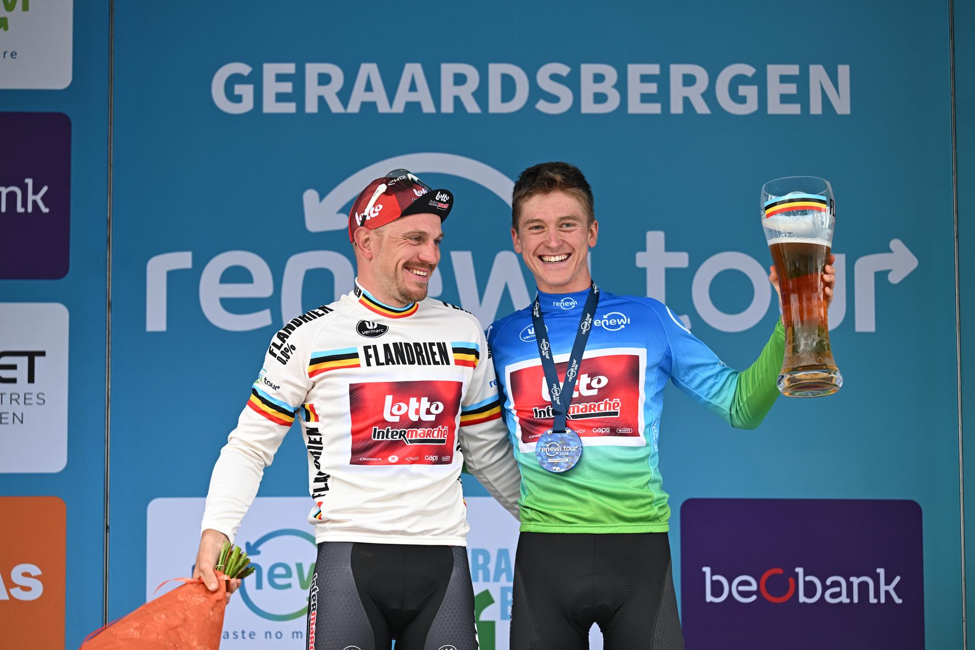 Belgian Lionel Taminiaux and Belgian Jenno Berckmoes of Lotto-Intermarche celebrate on the podium of stage three of the 'Renewi Tour' multi-stage cycling race, from Celles to Geraardsbergen (182 km) on Friday 21 August 2026. The five-day race takes place from 19 to 23/08. BELGA PHOTO DAVID PINTENS