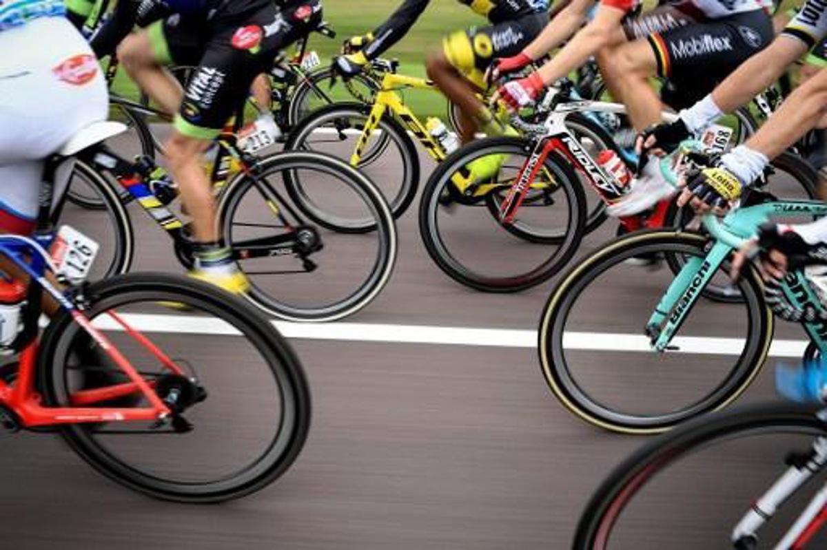 Wheels are pictured as cyclists ride in the pack during the 183 km second stage of the 103rd edition of the Tour de France cycling race on July 3, 2016 between Saint-Lo and Cherbourg-en-Cotentin, Normandy. 
jeff pachoud / AFP