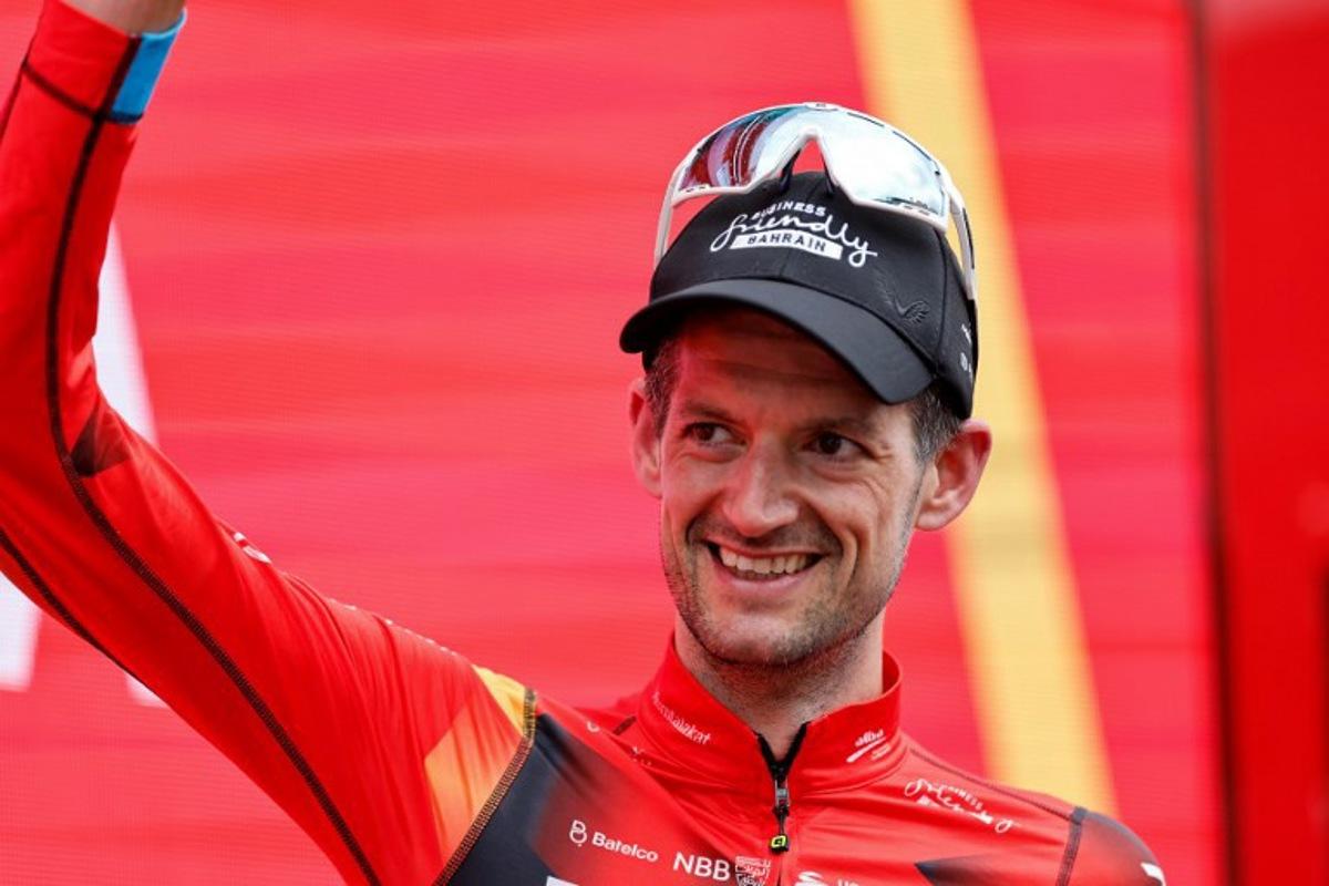 Team Bahrain's Dutch rider Wout Poels celebrate on the podium after winning the stage 20 of the 2023 La Vuelta cycling tour of Spain, a 207,8 km race between Manzanares el Real and Guadarrama, on September 16, 2023.  Oscar DEL POZO / AFP
