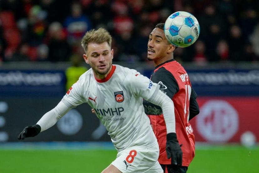 Heidenheim's Brazilian midfielder #08 Leonardo Scienza (L) and Bayer Leverkusen's Brazilian defender #13 Arthur vie for the ball during the German first division Bundesliga football match between Bayer 04 Leverkusen und 1 FC Heidenheim in Leverkusen, western Germany on November 23, 2024.  SASCHA SCHUERMANN / AFP