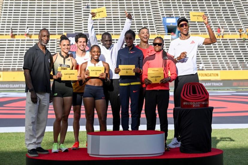 (L/R) Retired US Olympic and World Champion sprinter Michael Johnson poses alongside Grand Slam Champions USA's Sydney Mclaughlin-Levrone, USA's Grant Fisher, USA's Melissa Jefferson, Kenya's Emmanuel Wanyonyi, Ethiopia's Ejgayehu Taye, France's Sasha Zhoya, Jamaica's Danielle Williams and Brazil's Alison Dos Santos pose on the podium on the final day of the Grand Slam Track competition at the National Stadium in Kingston, Jamaica, on April 6, 2025.  Ricardo Makyn / AFP