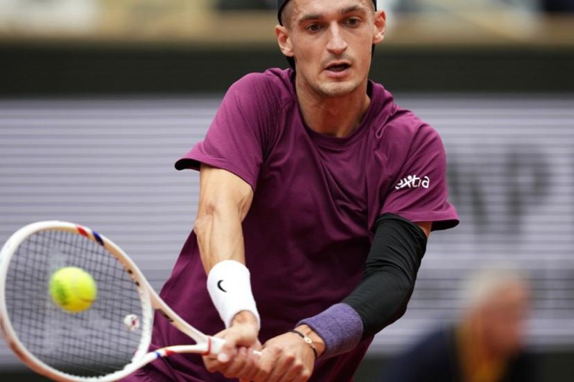 France's Terence Atmane plays a backhand return to France's Richard Gasquet during their men's singles match on day 2 of the French Open tennis tournament on Court Philippe-Chatrier at the Roland-Garros Complex in Paris on May 26, 2025.  Dimitar DILKOFF / AFP