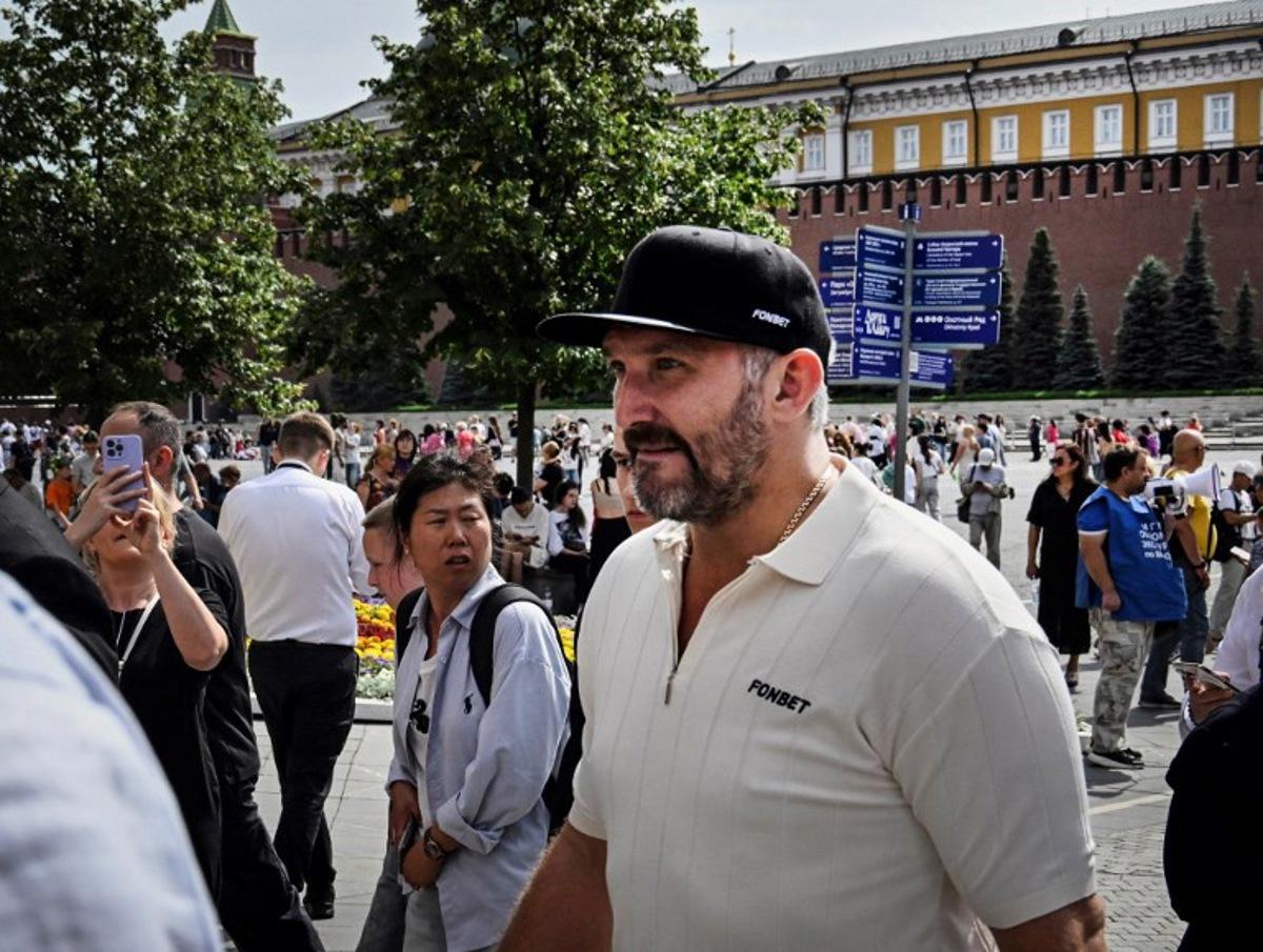 Russian NHL star Alexander Ovechkin walks along The Red Square in Moscow on July 19, 2025, during celebrations in his honour, after the Washington Capitals star scored his 895th goal breaking Wayne Gretzky's all time NHL record on April 6, 2025.  Alexander NEMENOV / AFP