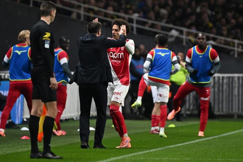 Monaco's French midfielder #11 Maghnes Akliouche (R) celebrates scoring a goal with Monaco's Belgian head coach Sébastien Pocognoli during  the French L1 football match between Nantes and Monaco  at La Beaujoire stadium, in Nantes, western France, on October 29, 2025.  Sebastien Salom-Gomis / AFP