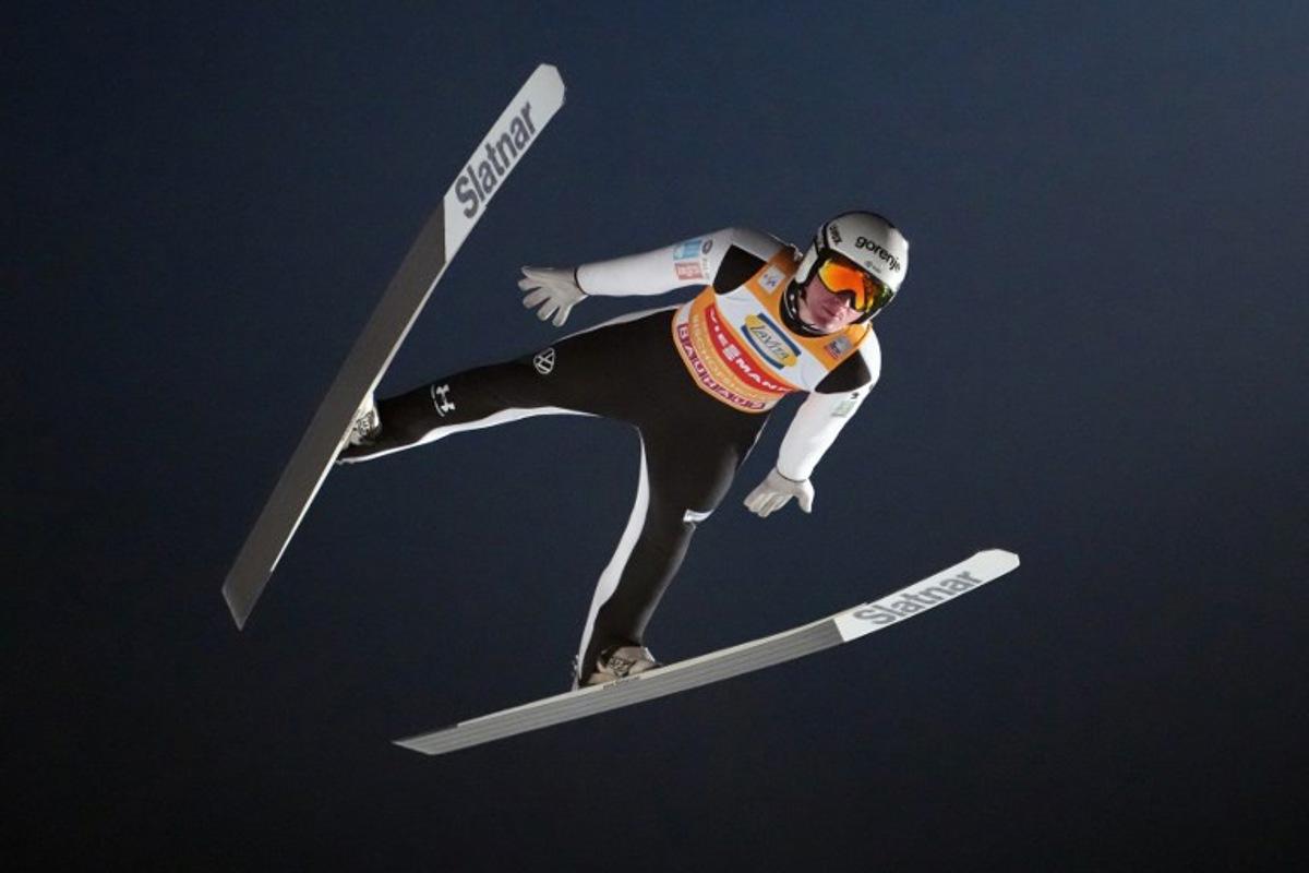 Slovenia's Domen Prevc soars through the air during the Men's Individual Large Hill HS142 event of the FIS Ski Jumping World Cup, the fourth and last leg of the Four Hills Tournament, in Bischofshofen, Austria on January 6, 2026.  GEORG HOCHMUTH / APA / AFP
