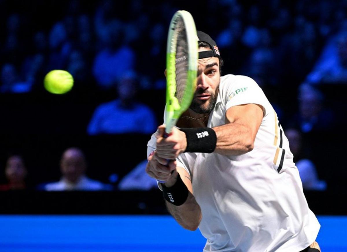 Italy's Matteo Berrettini returns the ball to Australia's Alex de Minaur during their men's quarter-final singles match at the ATP Vienna Open tennis tournament in Vienna, Austria, on October 24, 2025.  HELMUT FOHRINGER / APA / AFP