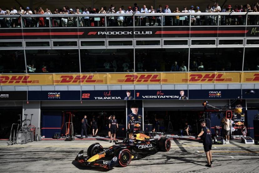 Red Bull Racing's Dutch driver Max Verstappen sits in his car in the pit during the qualifying session ahead of the Italian Formula One Grand Prix at the Autodromo Nazionale Monza circuit, in Monza, northern Italy, on September 6, 2025.  Marco BERTORELLO / POOL / AFP