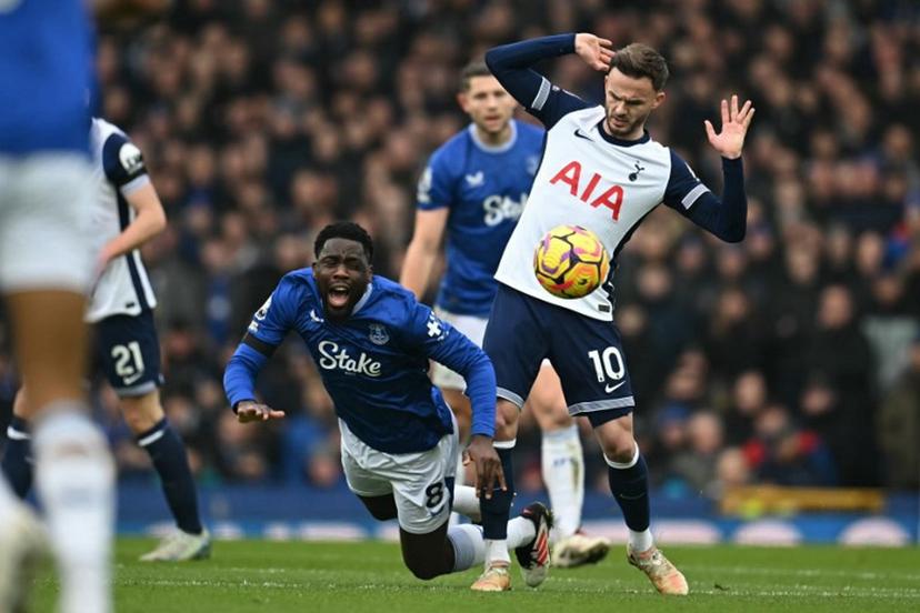 Everton's Belgian midfielder #08 Orel Mangala (L) vies with Tottenham Hotspur's English midfielder #10 James Maddison (R) during the English Premier League football match between Everton and Tottenham Hotspur at Goodison Park in Liverpool, north west England on January 19, 2025.  Paul ELLIS / AFP