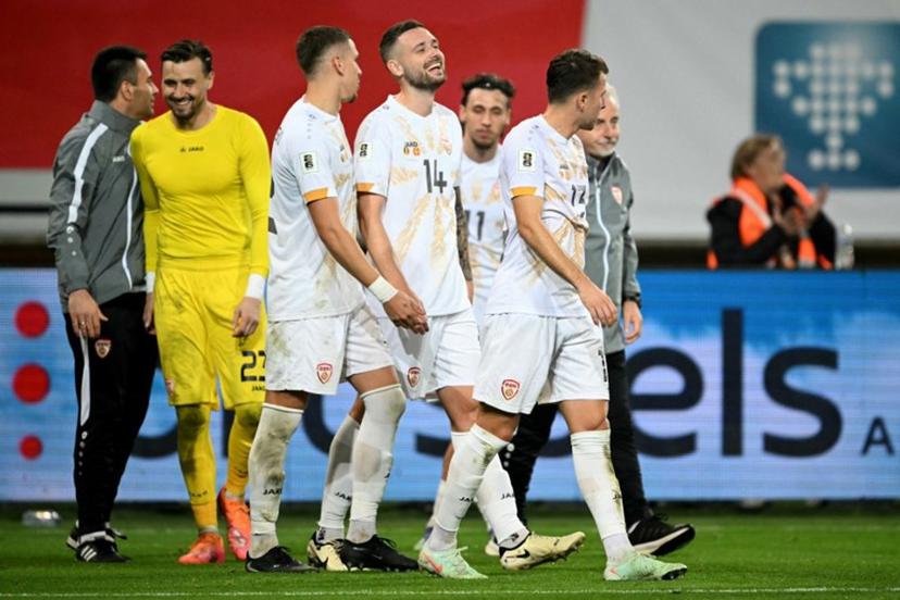 North Macedonia's players react at the end of the FIFA World Cup 2026 Group J European qualification football match between Belgium and North Macedonia at the Planet Group Arena in Ghent, on October 10, 2025.  NICOLAS TUCAT / AFP