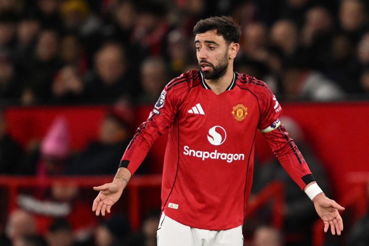 Manchester United's Portuguese midfielder #08 Bruno Fernandes gestures after Bournemouth take the lead during the English Premier League football match between Manchester United and Bournemouth at Old Trafford in Manchester, north west England, on December 15, 2025.  PETER POWELL / AFP