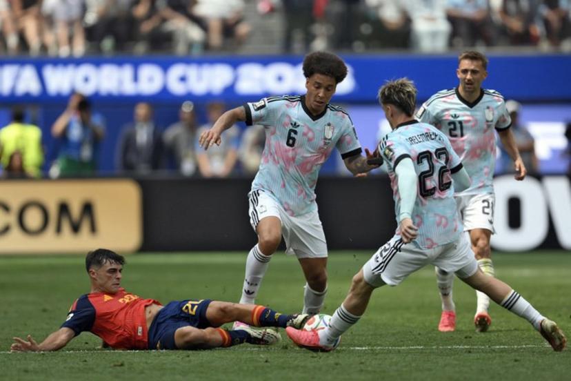 Spain's midfielder #20 Pedri, midfielder #06 Axel Witsel, and Belgium's forward #22 Alexis Saelemaekers fight for the ball during the 2026 World Cup football tournament quarter-final match between Spain and Belgium at the Los Angeles Stadium in Inglewood on July 10, 2026.   Patrick T. Fallon / AFP