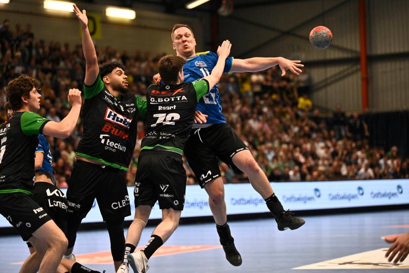 Bocholt's Rafal Przybylski fights for the ball during a handball game between Hubo handbal Hasselt and Achilles Bocholt, Saturday 19 April 2025, in Hasselt, the men's final of the Belgian handball cup. BELGA PHOTO JOHAN EYCKENS