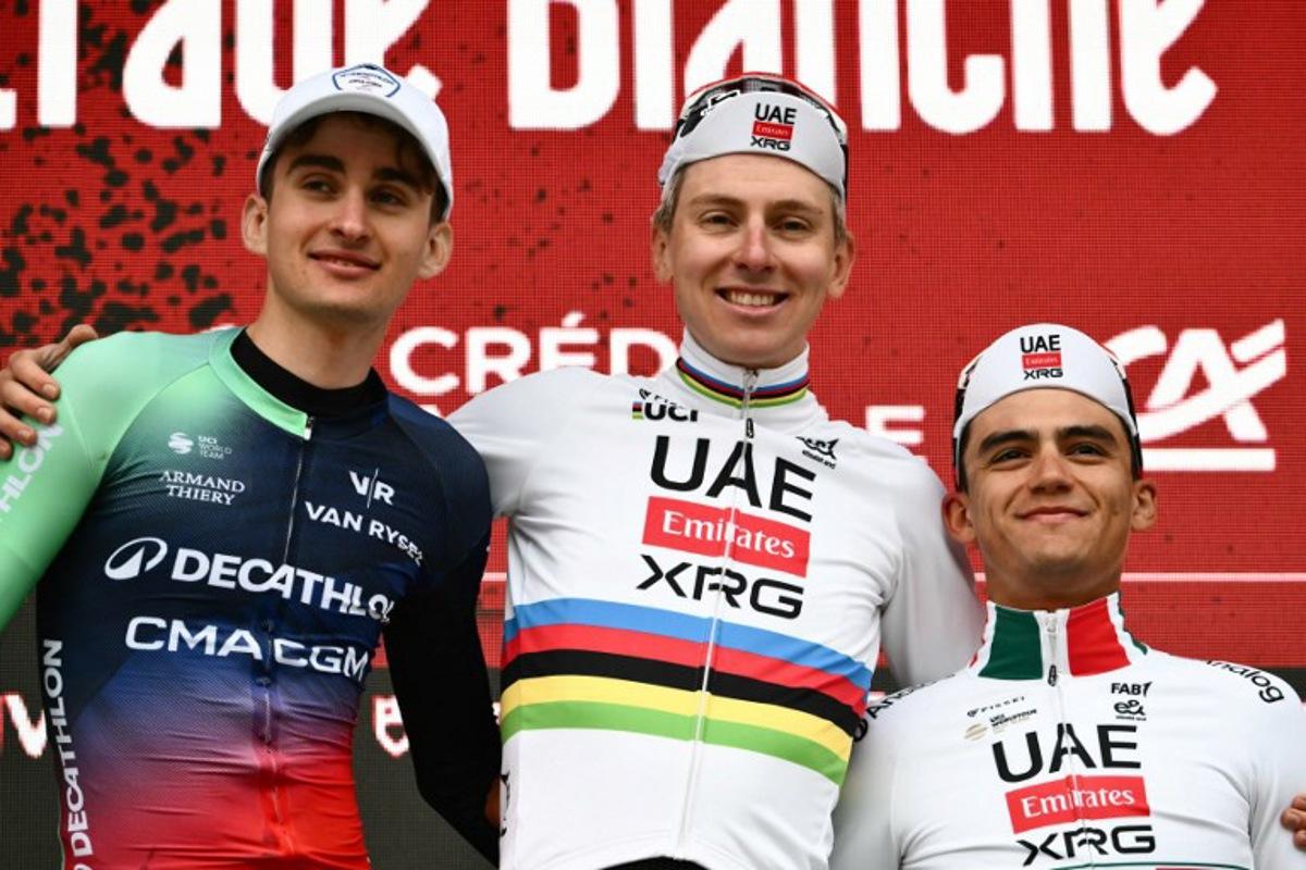 (From L) Second placed UCI WorldTeam Decathlon CMA CGM's French Paul Seixas, first placed UAE Team Emirates's Slovenian Tadej Pogacar and third placed Del UAE Team Emirates XRG's MexicanIsaac Del Toro Romero celebrate on the podium after competing in the 20th one-day classic 'Strade Bianche' (White Roads) men's cycling race between Siena and Siena in Tuscany on March 7, 2026.  Marco BERTORELLO / AFP