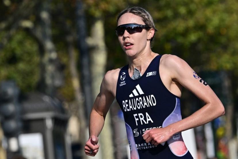 France's Cassandre Beaugrand runs during a Test Event for the women's triathlon for the upcoming 2024 Olympic Games in Paris, on August 17, 2023. From August 17 to 20, 2023, Paris 2024 is organising four triathlon events to test several arrangements, such as the sports operations, one year before the Paris 2024 Olympic and Paralympic Games. Miguel MEDINA / AFP