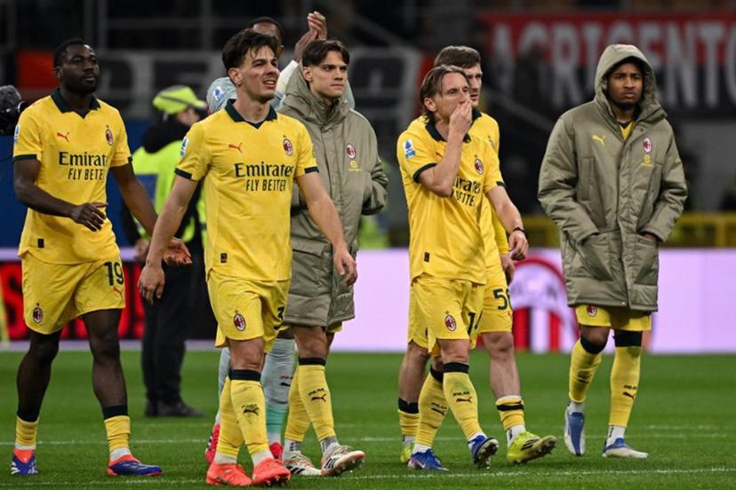 (From L) AC Milan's French midfielder #19 Youssouf Fofana, AC Milan's Italian midfielder #04 Samuele Ricci, AC Milan's Italian midfielder #04 Samuele Ricci, AC Milan's Croatian midfielder #14 Luka Modric and AC Milan's French forward #18 Christopher Nkunku react at the end of the Italian Serie A football match between AC Milan and Como at the San Siro Stadium in Milan, northern Italy, on February 18, 2026.  Piero CRUCIATTI / AFP