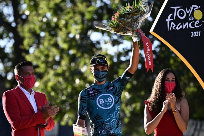Team B&B KTM's Franck Bonnamour of France celebrates on the podium his super combative price at the end of the 21th and last stage of the 108th edition of the Tour de France cycling race, 108 km between Chatou and Paris Champs-Elysees, on July 18, 2021.  Anne-Christine POUJOULAT / AFP