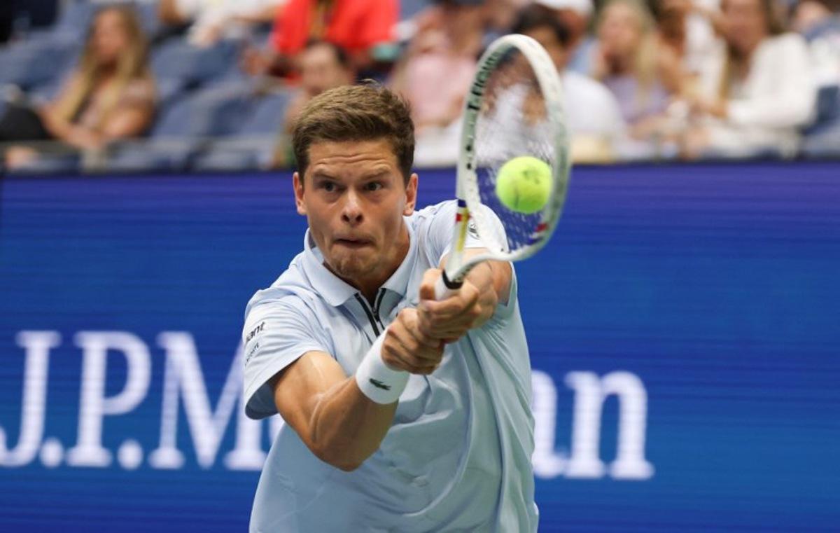 Belgium's Alexander Blockx returns the ball to Russia's Karen Khachanov during the men's singles quarter-final tennis match on day eleven of the US Open tennis tournament at the USTA Billie Jean King National Tennis Center in New York City on September 9, 2026.  TIMOTHY A. CLARY / AFP