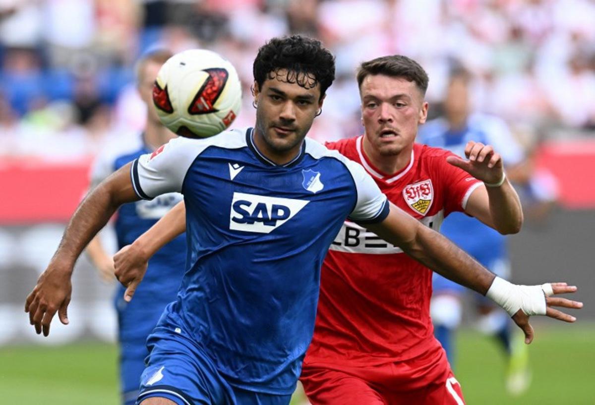 Hoffenheim's Turkish defender #05 Ozan Kabak (L) and Stuttgart's German forward #17 Dzenan Pejcinovic vie for the ball during the German first division Bundesliga football match between Hoffenheim and VfB Stuttgart in Sinsheim on September 12, 2026.  THOMAS KIENZLE / AFP