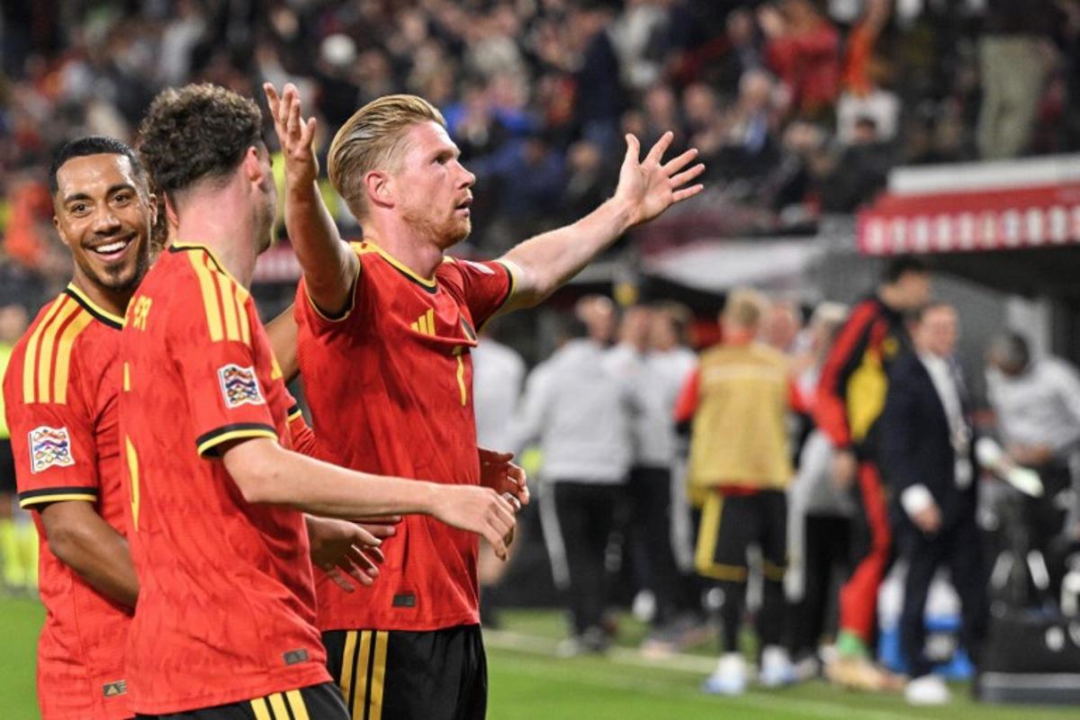 Belgium's midfielder #07 Kevin De Bruyne (R) celebrates with teammates after scoring his team second goal during the UEFA Nations League, League A - Group 1, football match between Belgium and Turkey at the Maurice Dufrasne stadium, in Liege, eastern Belgium on October 2, 2026.  JOHN THYS / AFP