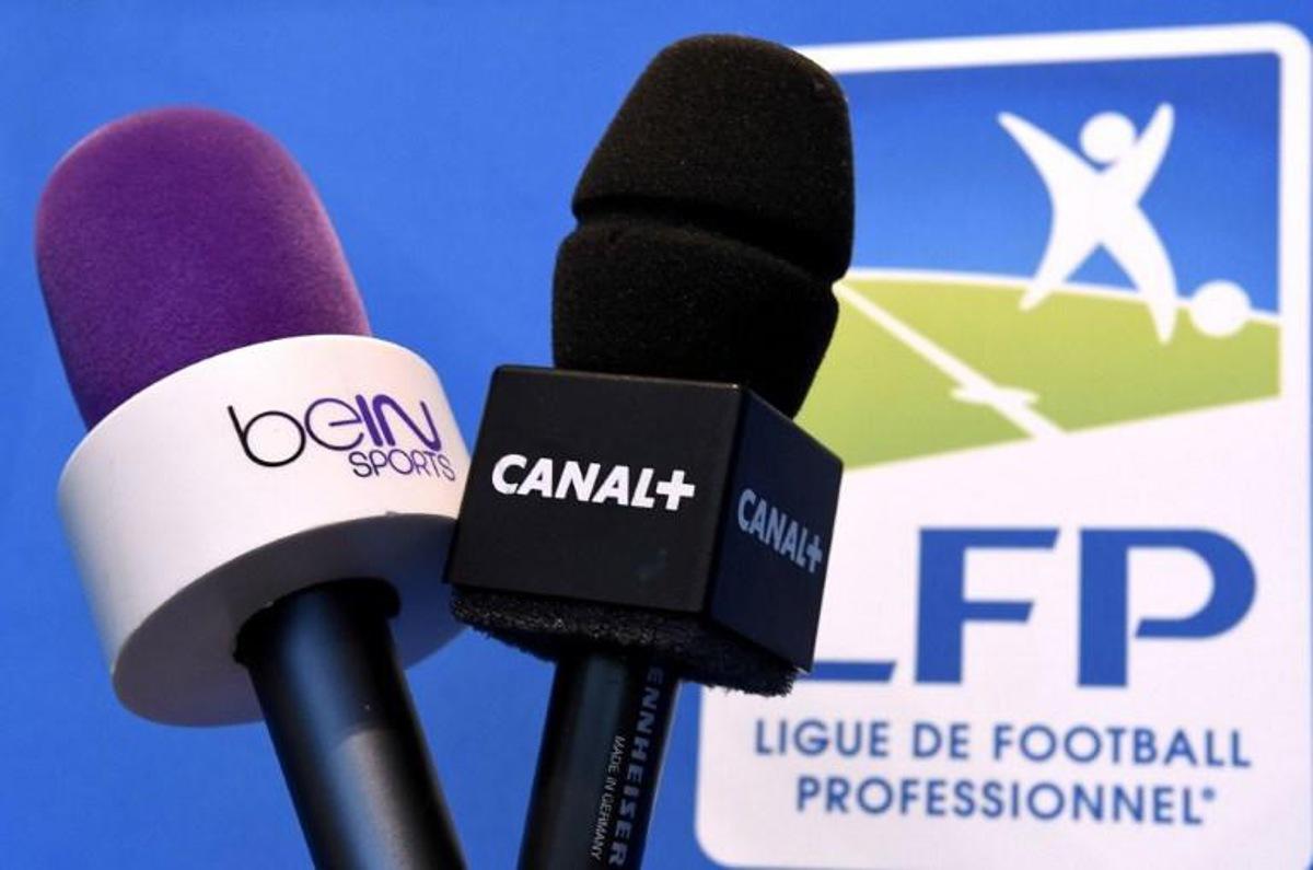 Photo taken on April 4, 2014 in Paris shows microphones of French television channel Canal + and Qatari station BeIn Sports. The French Ligue de Football Professionnel (LFP) awarded on April 4 the broadcasting rights for the French Ligue 1 and Ligue 2 football matches for the period 2016-2020 for a record 748.5 million EUR per year. The paying television channel, Canal +, will have the rights to the three best matches of each day. Canal +'s Qatari rival BeIn Sports won the remaining rights.  AFP PHOTO / FRANCK FIFE  Franck FIFE / AFP