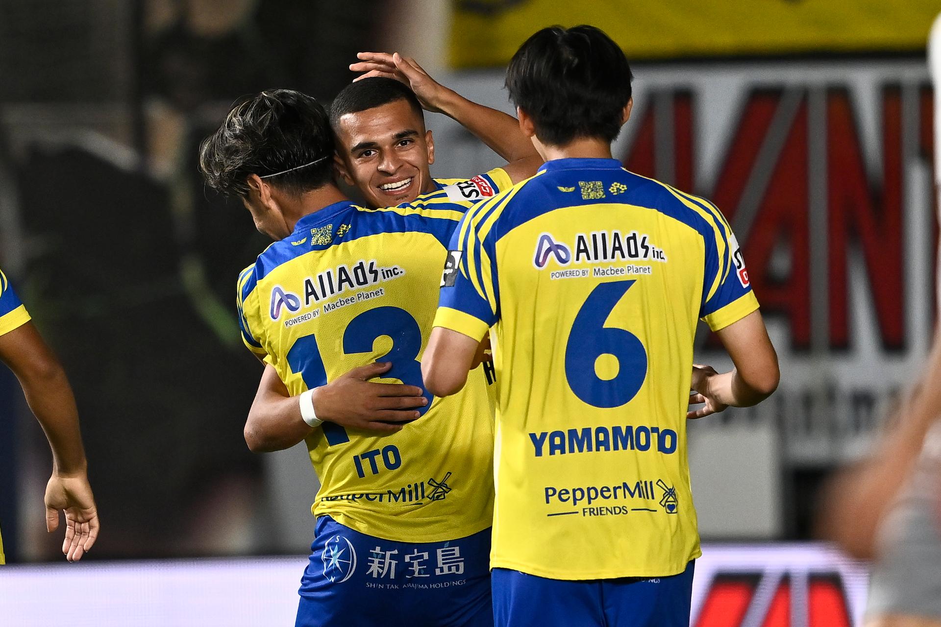 STVV's Ryotaro Ito and STVV's Ilias Sebaoui celebrate after scoring during a soccer match between Sint-Truiden VV and FCV Dender EH, Friday 08 August 2025 in Sint-Truiden, on the day 3 of the 2025-2026 'Jupiler Pro League' first division of the Belgian championship. BELGA PHOTO JOHAN EYCKENS