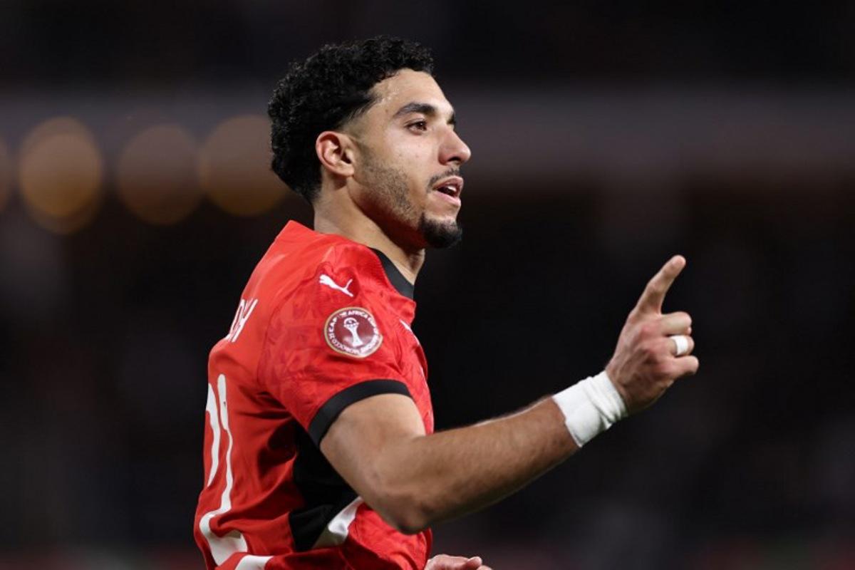 Egypt's forward #22 Omar Marmoush celebrates scoring the team's first goal during the Africa Cup of Nations (CAN) group B football match between Egypt and Zimbabwe at Adrar Stadium in Agadir on December 22, 2025.   FRANCK FIFE / AFP