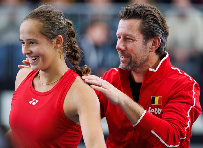 Belgian Hanne Vandewinkel and Belgian team captain Wim Fissette celebrate after a tennis match between Belgian Vandewinkel and German Seidel, the second match of the meeting between Belgium and Germany in the Billie Jean King Cup Play-offs, on Sunday 16 November 2025 in Ismaning, Germany. PHOTO BENOIT DOPPAGNE