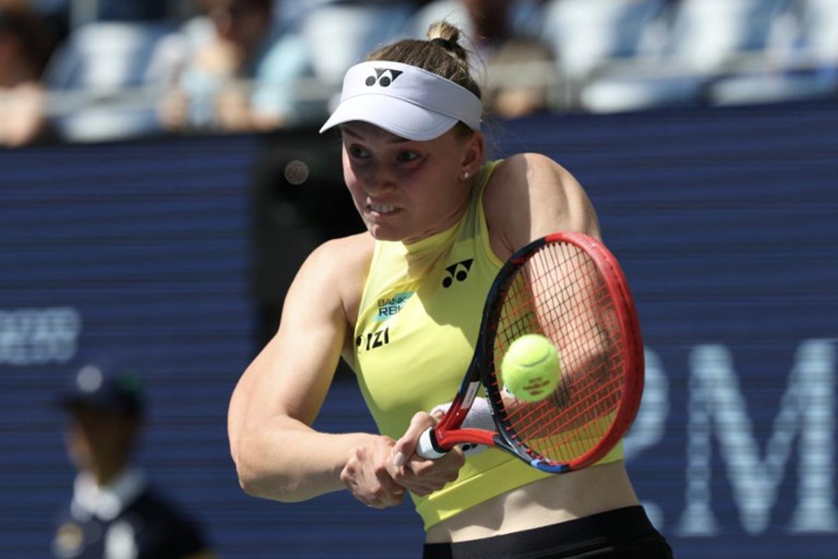Kazakhstan's Elena Rybakina hits a return against China's Zheng Qinwen during their women's singles quarter-final tennis match on day eleven of the US Open tennis tournament at the USTA Billie Jean King National Tennis Center in New York City on September 9, 2026.  TIMOTHY A. CLARY / AFP