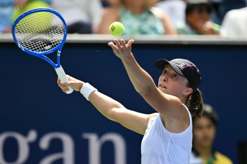 Poland's Iga Swiatek serves to Russia's Ekaterina Alexandrova  during their women's singles round of 16 tennis match on day nine of the US Open tennis tournament at the USTA Billie Jean King National Tennis Center in New York City, on September 1, 2025.  ANGELA WEISS / AFP