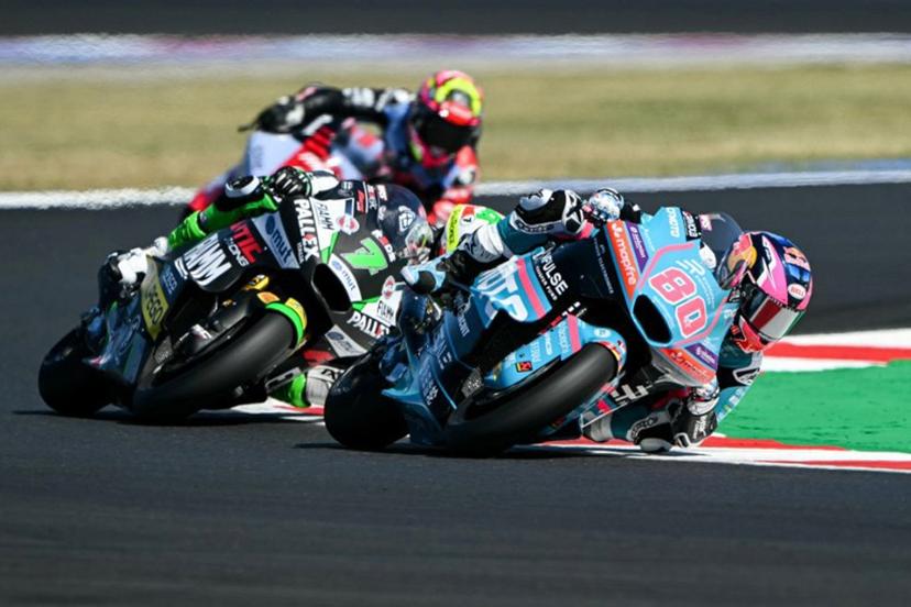 REDS Fantic Racing's Belgian rider Barry Baltus (C) and CFMOTO Aspar European Privilege Team's Colombian rider David Alonso compete during the qualifying session for the Moto2 race as part of the Misano World Circuit Marco Simoncelli, in Misano Adriatico, northern Italy on September 12, 2026.  Andreas SOLARO / AFP