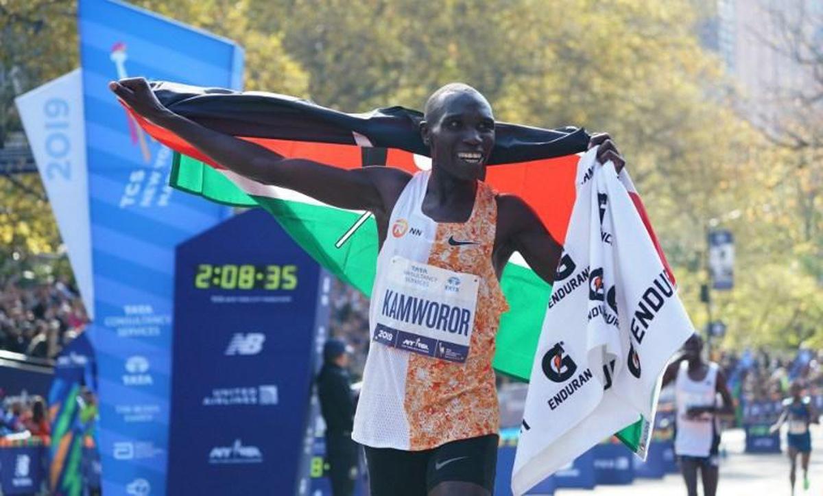 Geoffrey Kamworor of Kenya cheers after he crosses the finish line to win the Professional Men's Finish during the 2019 TCS New York City Marathon in New York on November 3, 2019. Geoffrey Kamworor and Joyciline Jepkosgei sealed a double victory for Kenya at the New York Marathon on Sunday, storming to convincing wins in the men's and women's races at the annual showpiece. Kamworor, the 2017 New York champion, pulled clear in the closing stages to take the tape in Central Park 2hr 8min 13sec. TIMOTHY A. CLARY / AFP