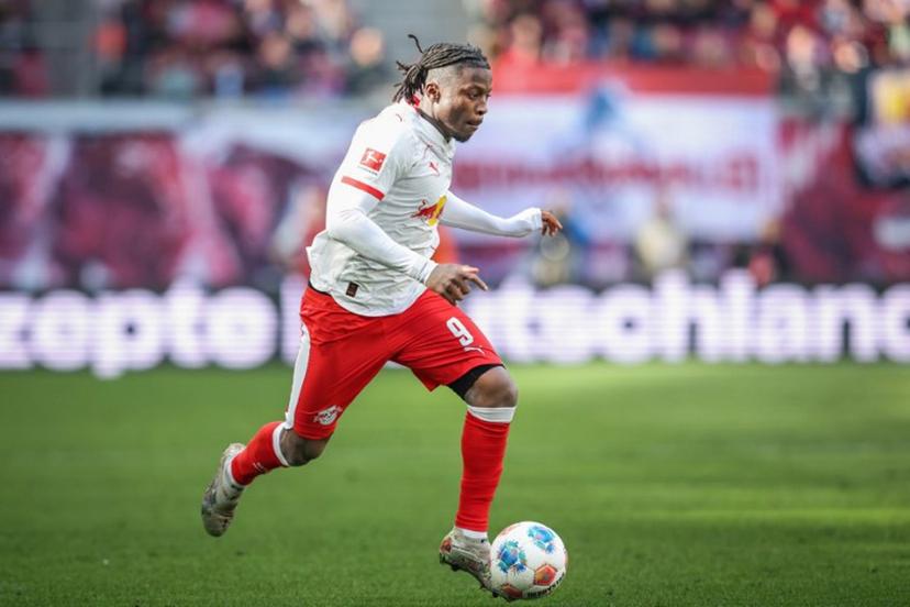 Leipzig's Belgian forward #09 Johan Bakayoko plays the ball during the German first division Bundesliga football match between RB Leipzig and Borussia Moenchengladbach in Leipzig, eastern Germany, on April 11, 2026.  Ronny HARTMANN / AFP
