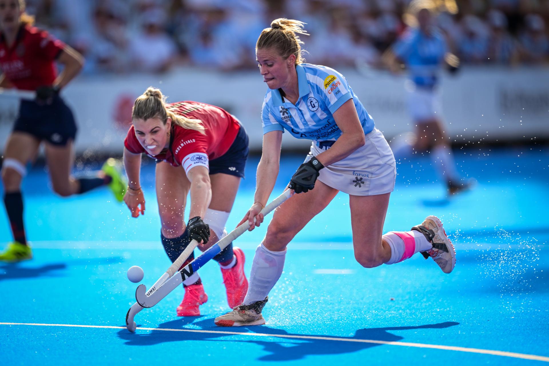 Dragons' Valerie Magis and Gantoise's Alix Gerniers fight for the ball during a hockey game between Gantoise and Dragons, Sunday 24 May 2026 in Wavre, the return leg of the women's Finals of the Belgian first division hockey championship. BELGA PHOTO DAVID PINTENS