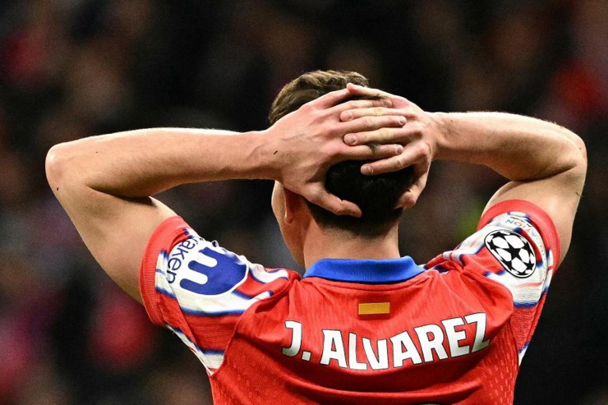 Atletico Madrid's Argentine forward #19 Julian Alvarez reacts during the UEFA Champions League Round of 16 second leg football match between Club Atletico de Madrid and Real Madrid CF at the Metropolitano stadium in Madrid on March 12, 2025.  JAVIER SORIANO / AFP