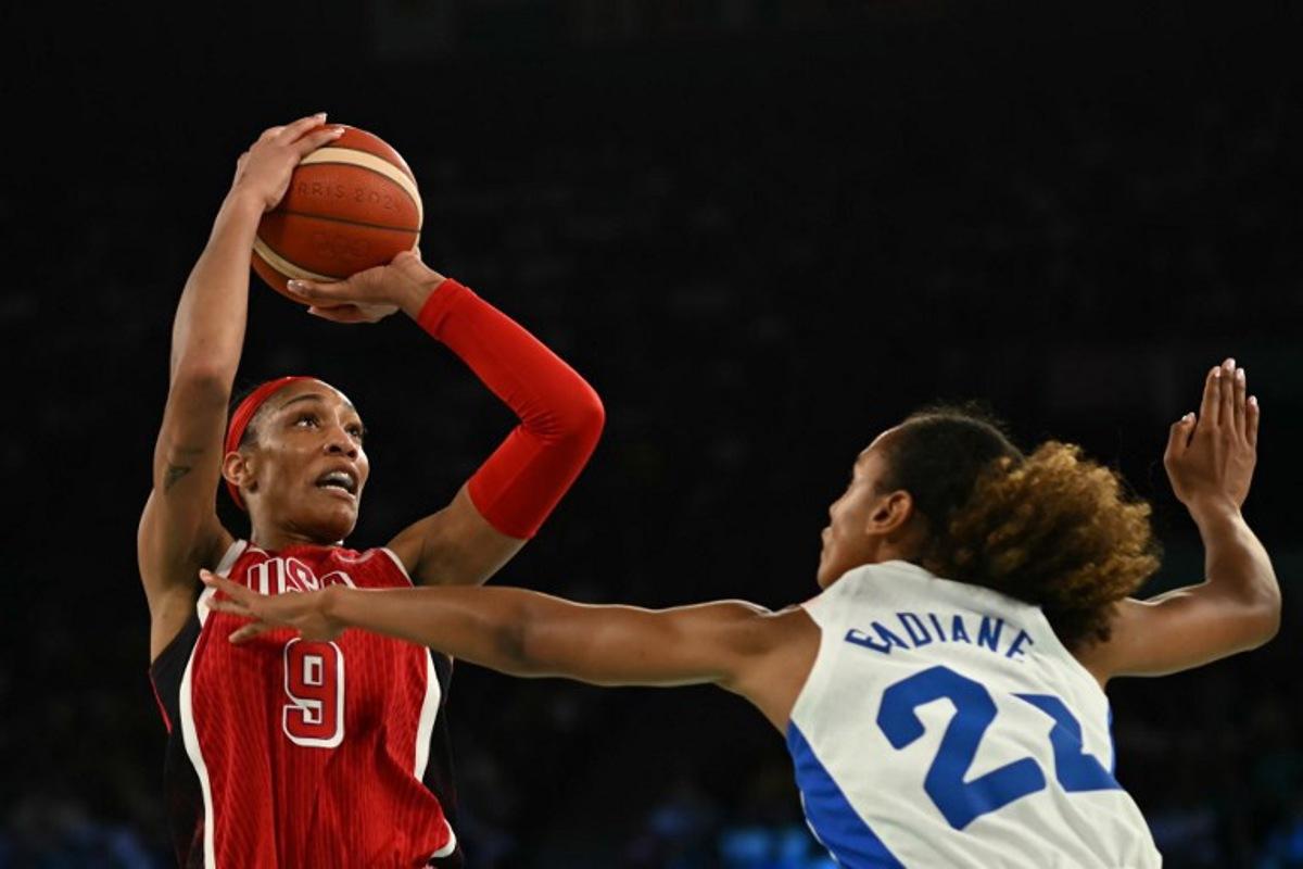 USA's #09 A'ja Wilson takes a shot over France's #22 Marieme Badiane in the women's Gold Medal basketball match between France and the USA during the Paris 2024 Olympic Games at the Bercy  Arena in Paris on August 11, 2024.  Paul ELLIS / AFP