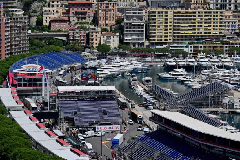 This photograph taken on May 22, 2024 shows yachts docked at the Monte Carlo harbour in front of the stands of the Circuit de Monaco, four days ahead of the Formula One Monaco Grand Prix.  Andrej ISAKOVIC / AFP