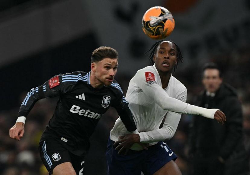 Aston Villa's Polish defender  #02 Matty Cash (L) vies with Tottenham Hotspur's French midfielder #11 Mathys Tel during the English third round FA Cup football match between Tottenham Hotspur and Aston Villa at Tottenham Hotspur Stadium in London, on January 10, 2026.  Glyn KIRK / AFP