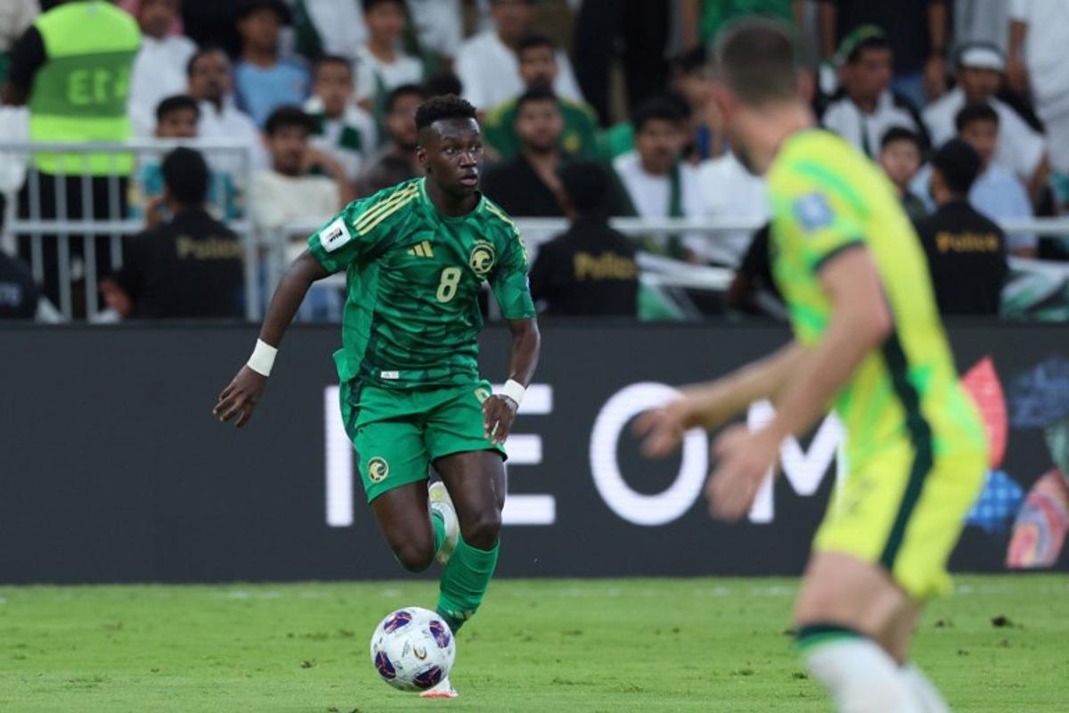 Saudi Arabia's midfielder #8 Marwan Al-Sahafi runs with the ball during the FIFA World Cup 2026 Asia zone qualifiers group C football match between Saudi Arabia and Australia at the King Abdullah Sport City in Jeddah on June 10, 2025.  Abdel Ghani BASHIR / AFP